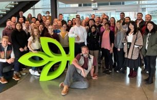 Ancestry team members with green logo leaf